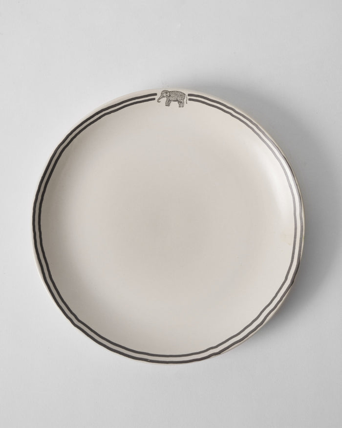 Tusk Dinner Plate with a grey elephant motif and double rim lines.