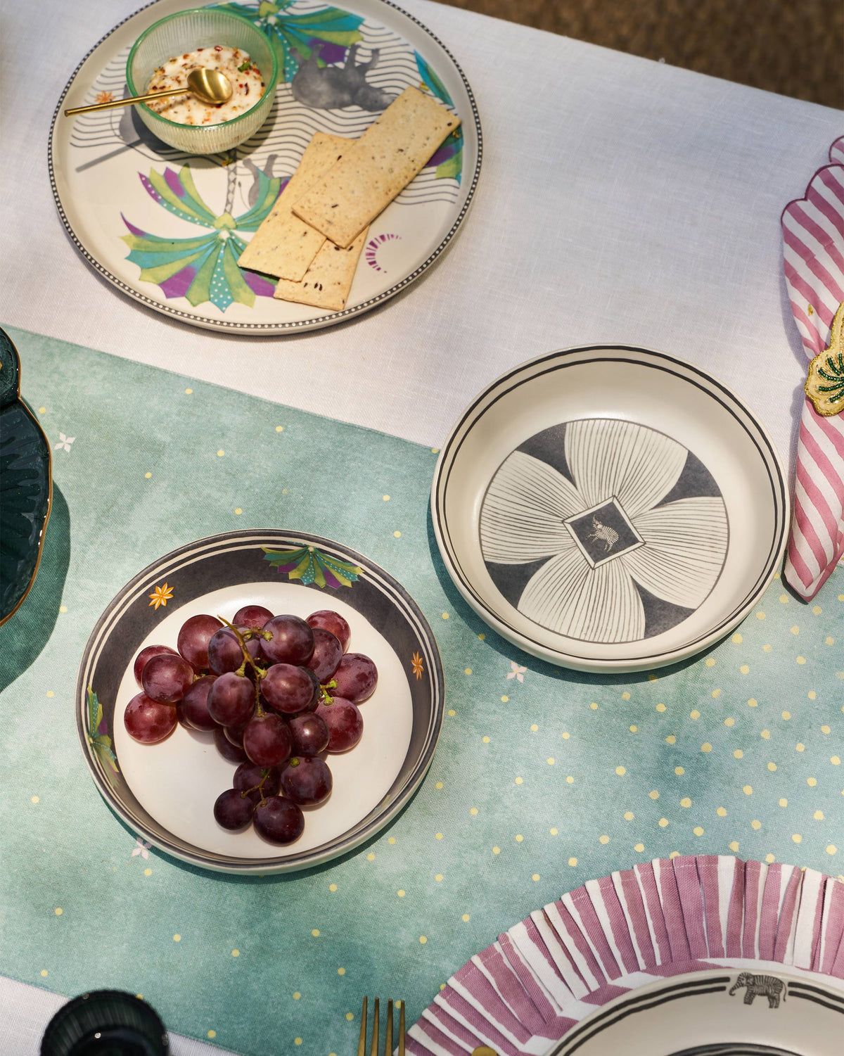 Palm Bloom shallow bowls used for snacks at a dressed table.