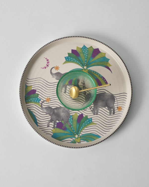 The platter from above, elephants and a palm around the centre
