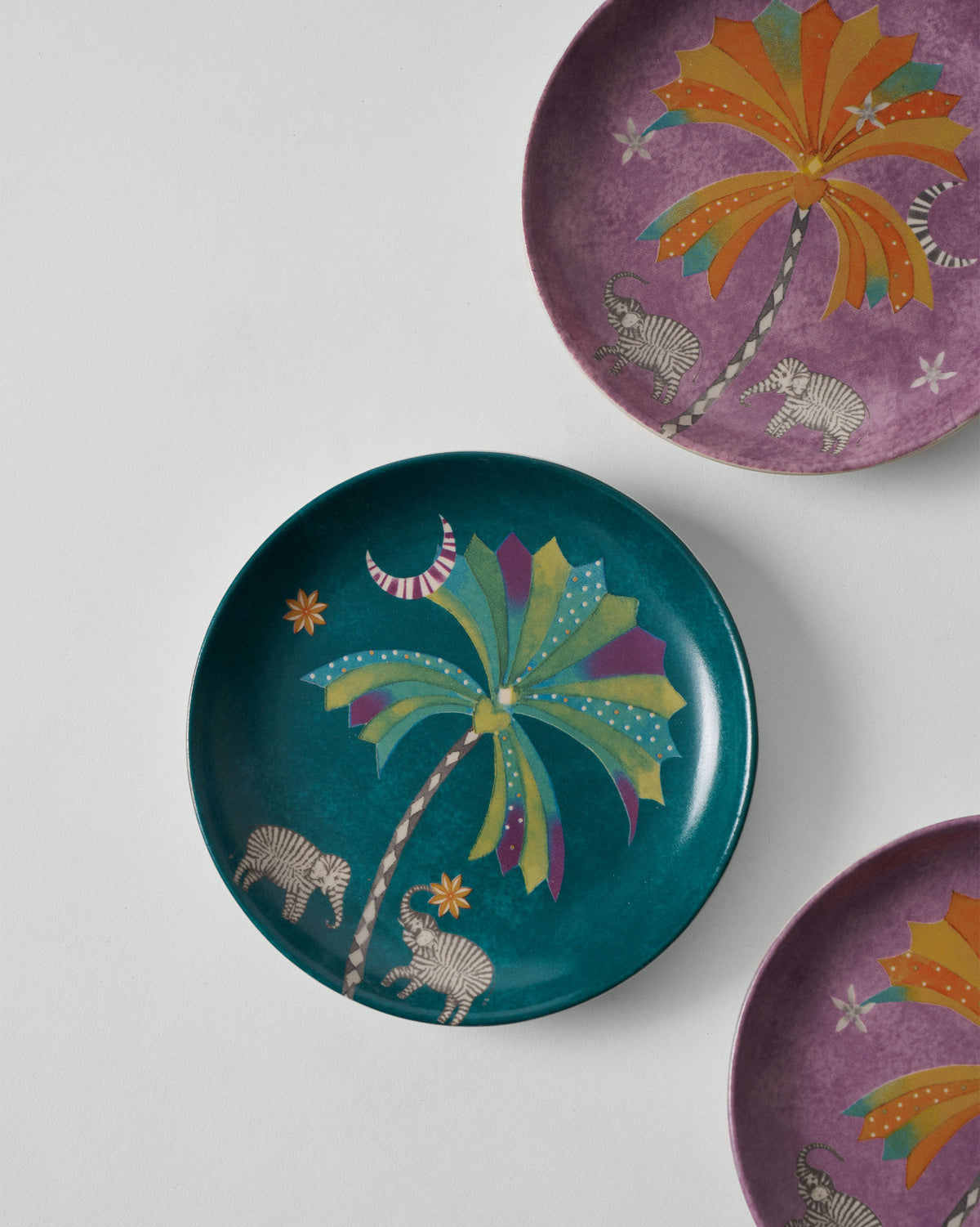 Teal Palm Bloom tea plate with palm tree and striped elephants.