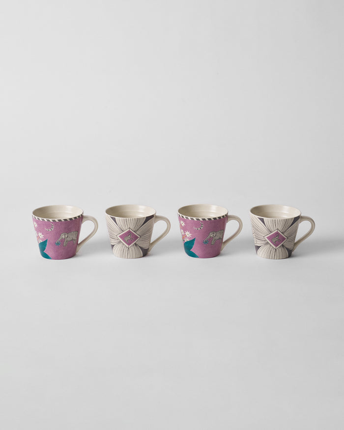 Set of four Mogra Bloom espresso mugs with magenta elephant and cream floral designs.
