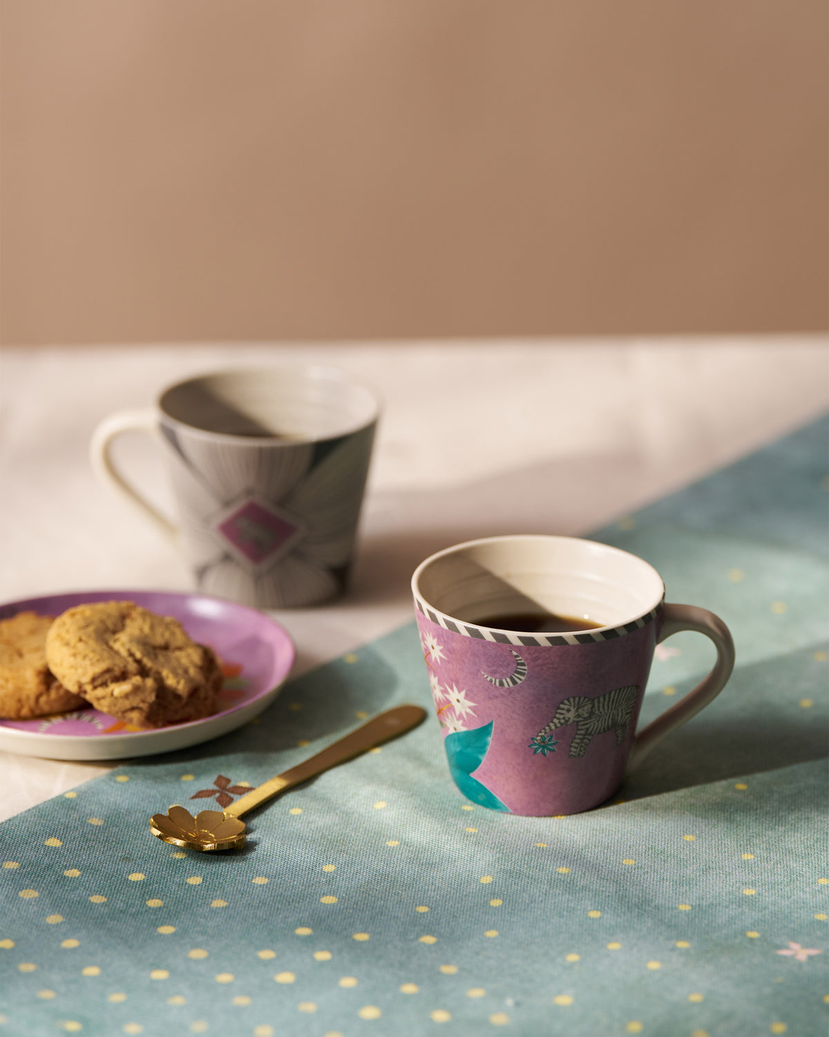Magenta Mogra Bloom espresso mug with an elephant motif filled with coffee.