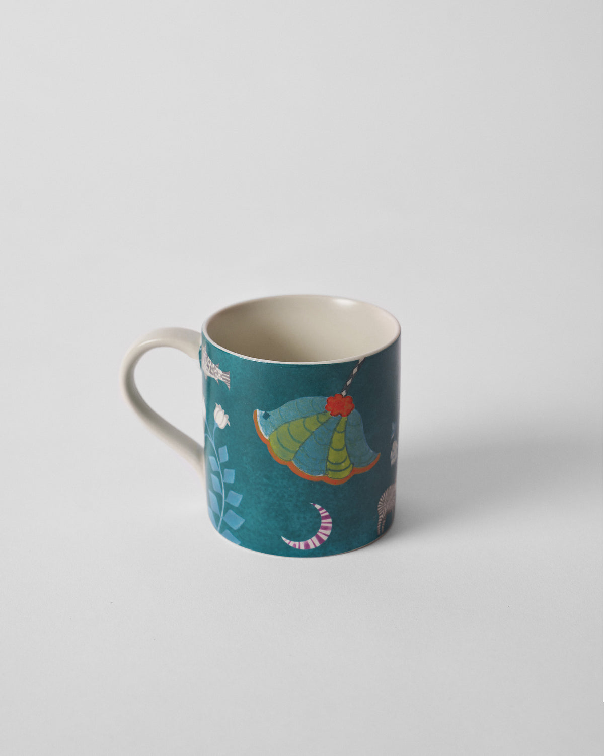 Side view of a Tusk Bloom Straight Mug with a green and orange canopy motif.