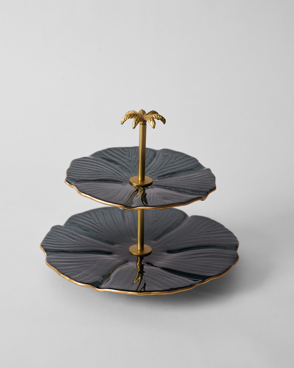Phool Cake Stand - Charcoal seen at an angle, with a gold palm top.
