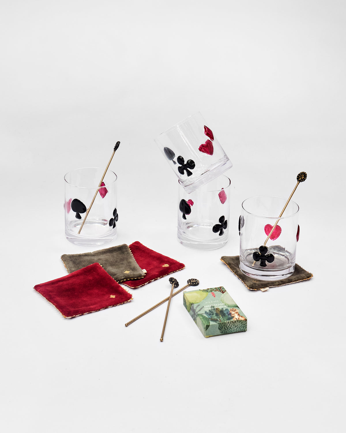 Mehfil bar set glasses with card suits, velvet coasters, and stirrers.