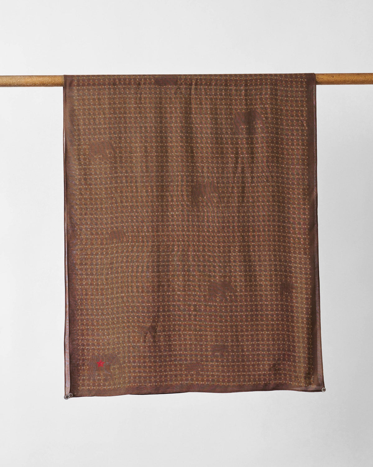 Heera scarf hung flat in brown with a small dotted pattern.