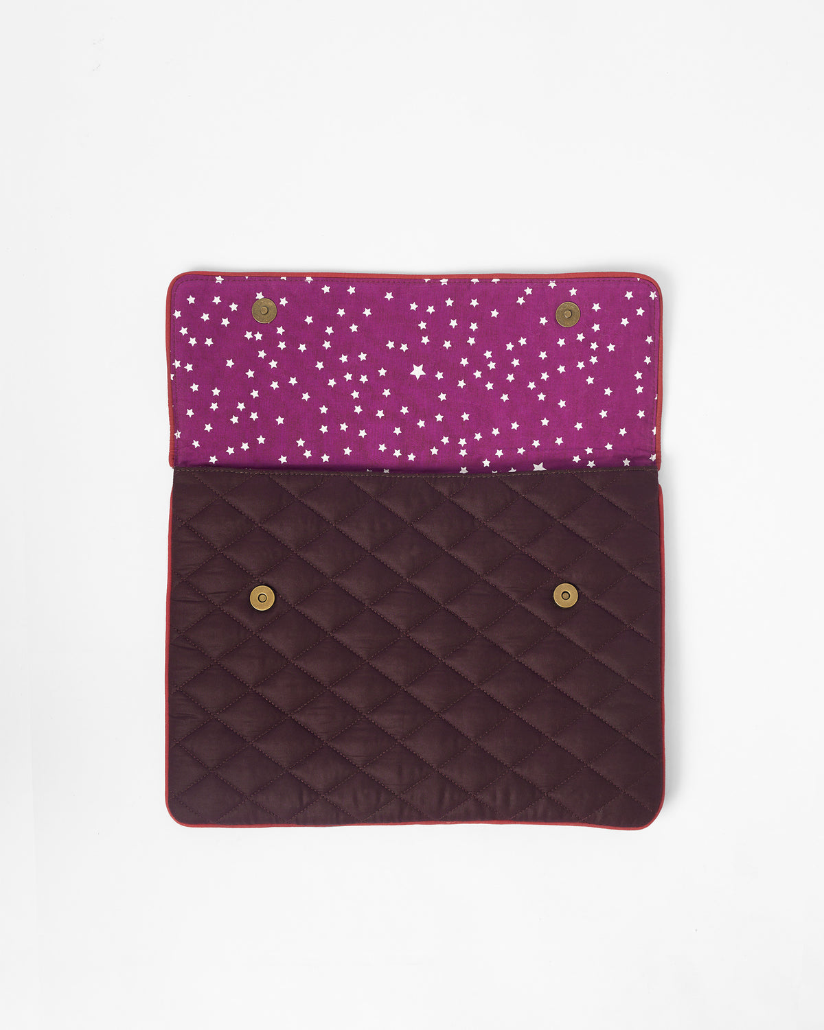 Open brown Ele laptop sleeve with star lining and magnetic snaps.