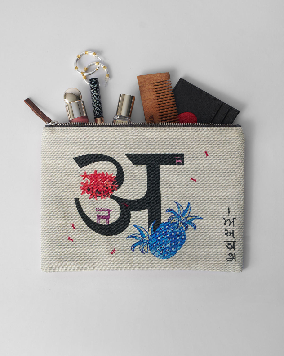 Ivory Anaar Pouch packed with cosmetics and everyday essentials.