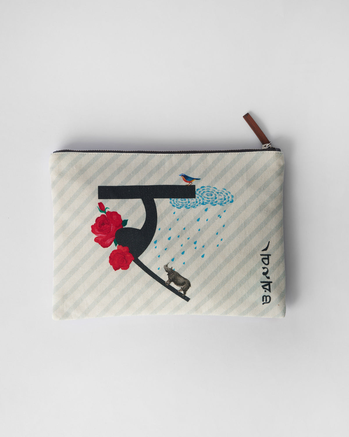 Ivory Rimjhim Pouch with a black letter print, roses, rain, and a rhinoceros.