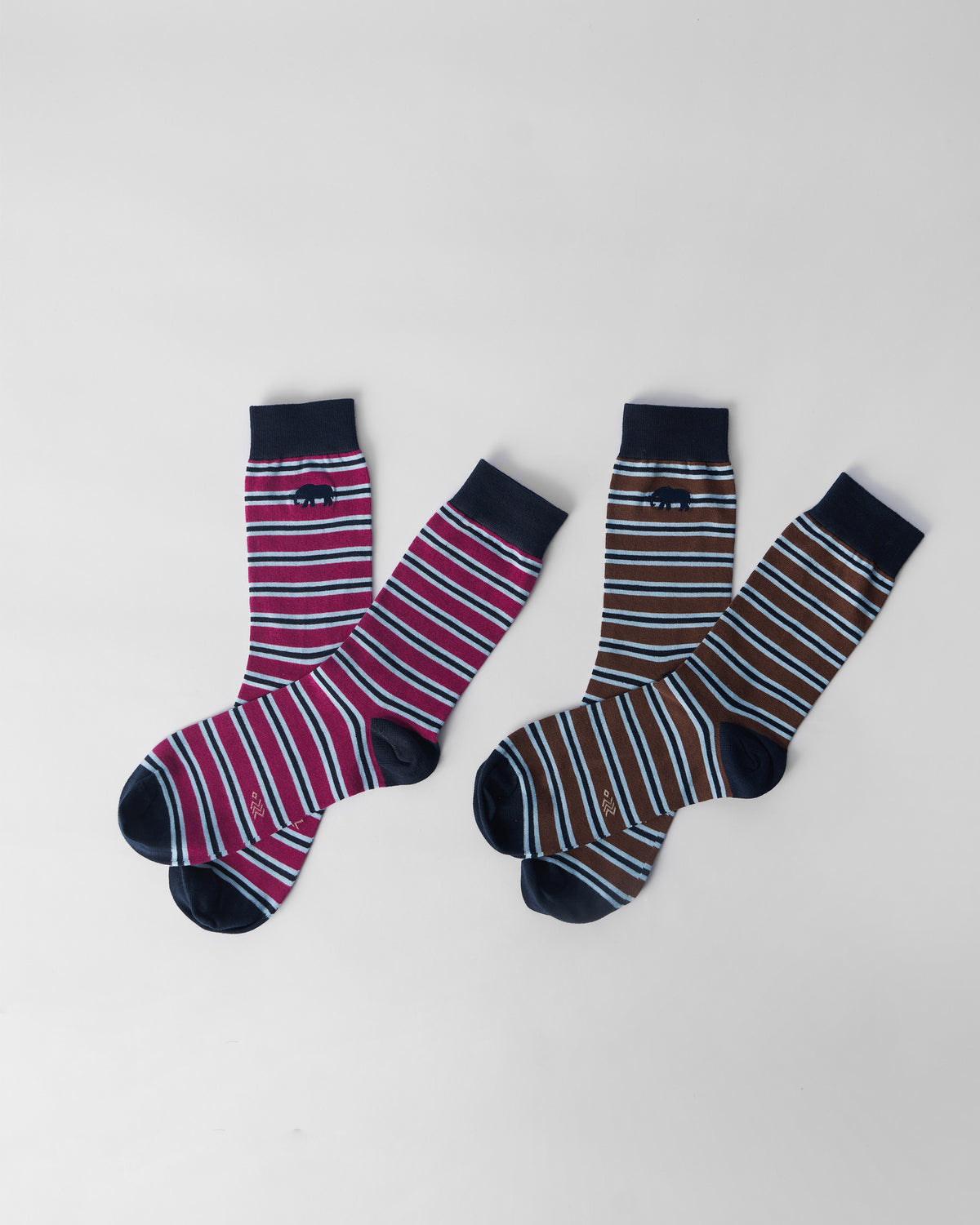 Stripey Socks set flat lay of mulberry and brown striped pairs with navy accents.
