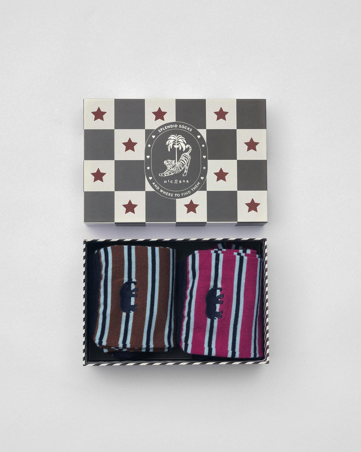 Stripey Socks gift set open in a checkerboard Nicobar box with mulberry and brown pairs.