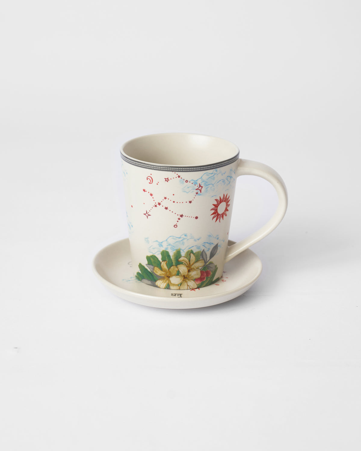 Nico Sagittarius mug with constellation and frangipani beside a Dhanu plate.