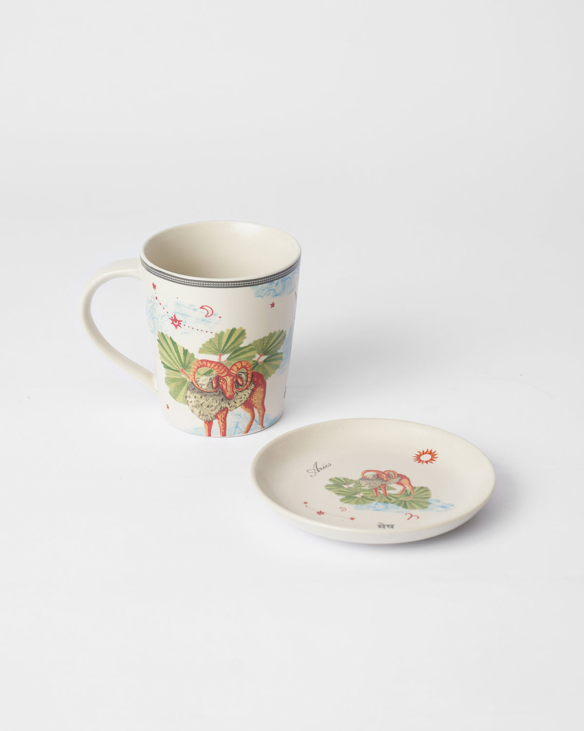 Nico Aries mug with a ram print beside a matching tea plate.