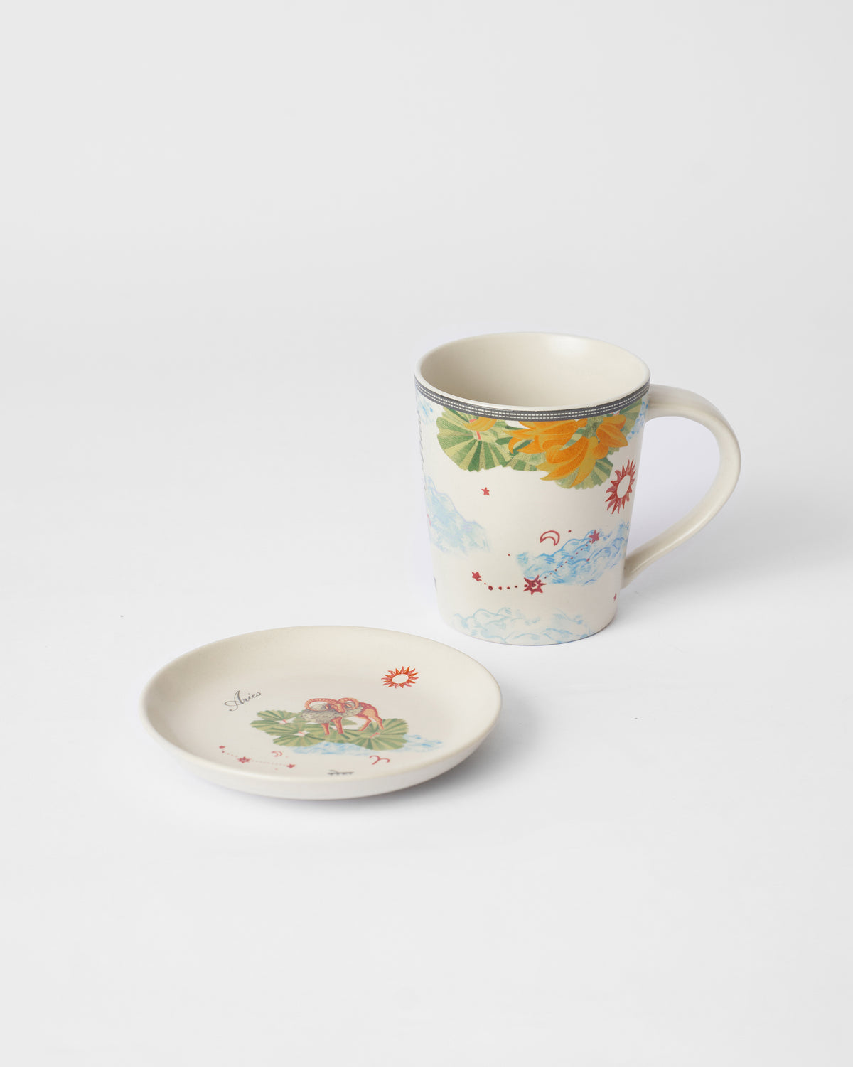 Nico Aries tea plate with a ram motif beside the matching mug.