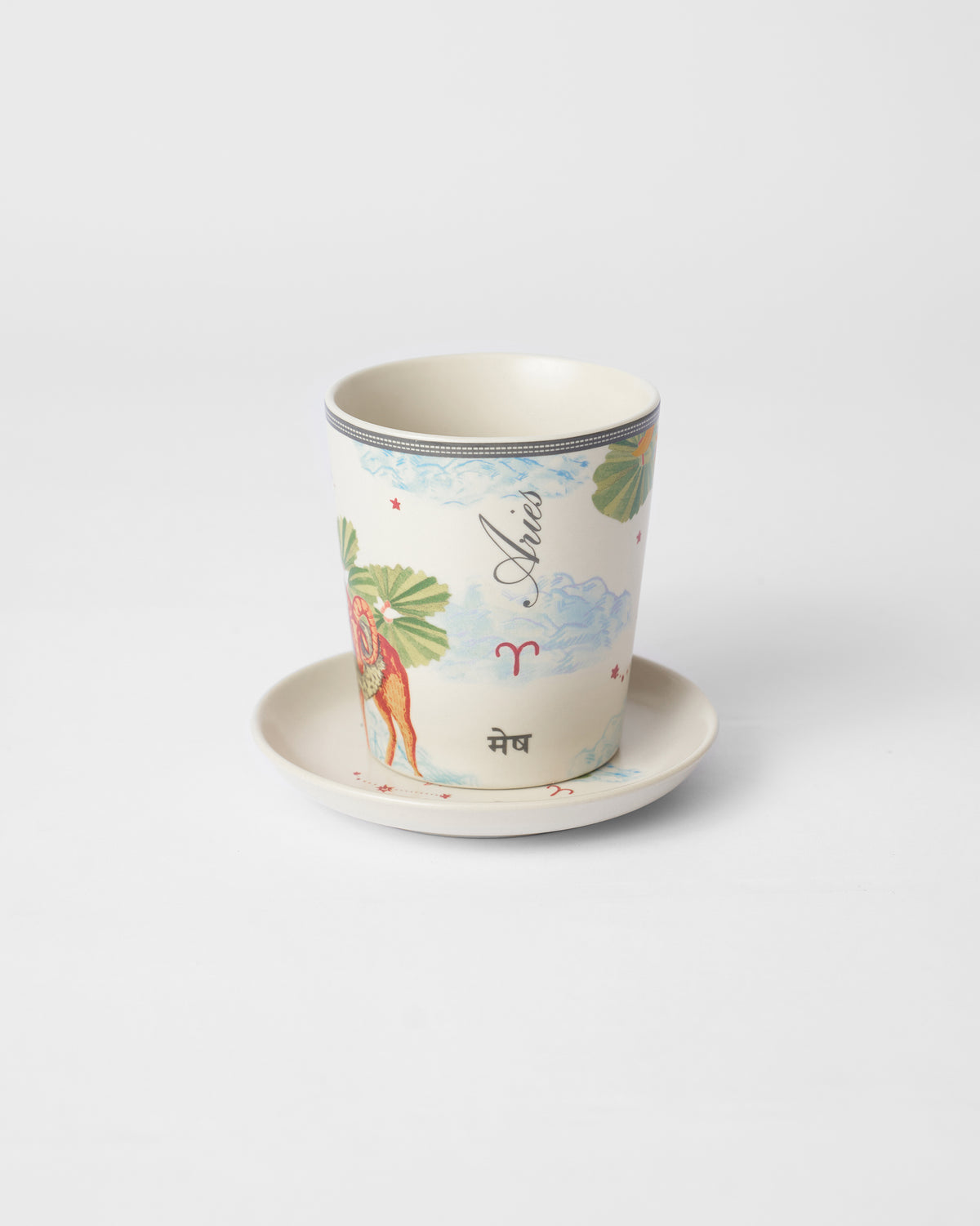 Nico Aries mug on its tea plate showing Aries and मेष lettering.