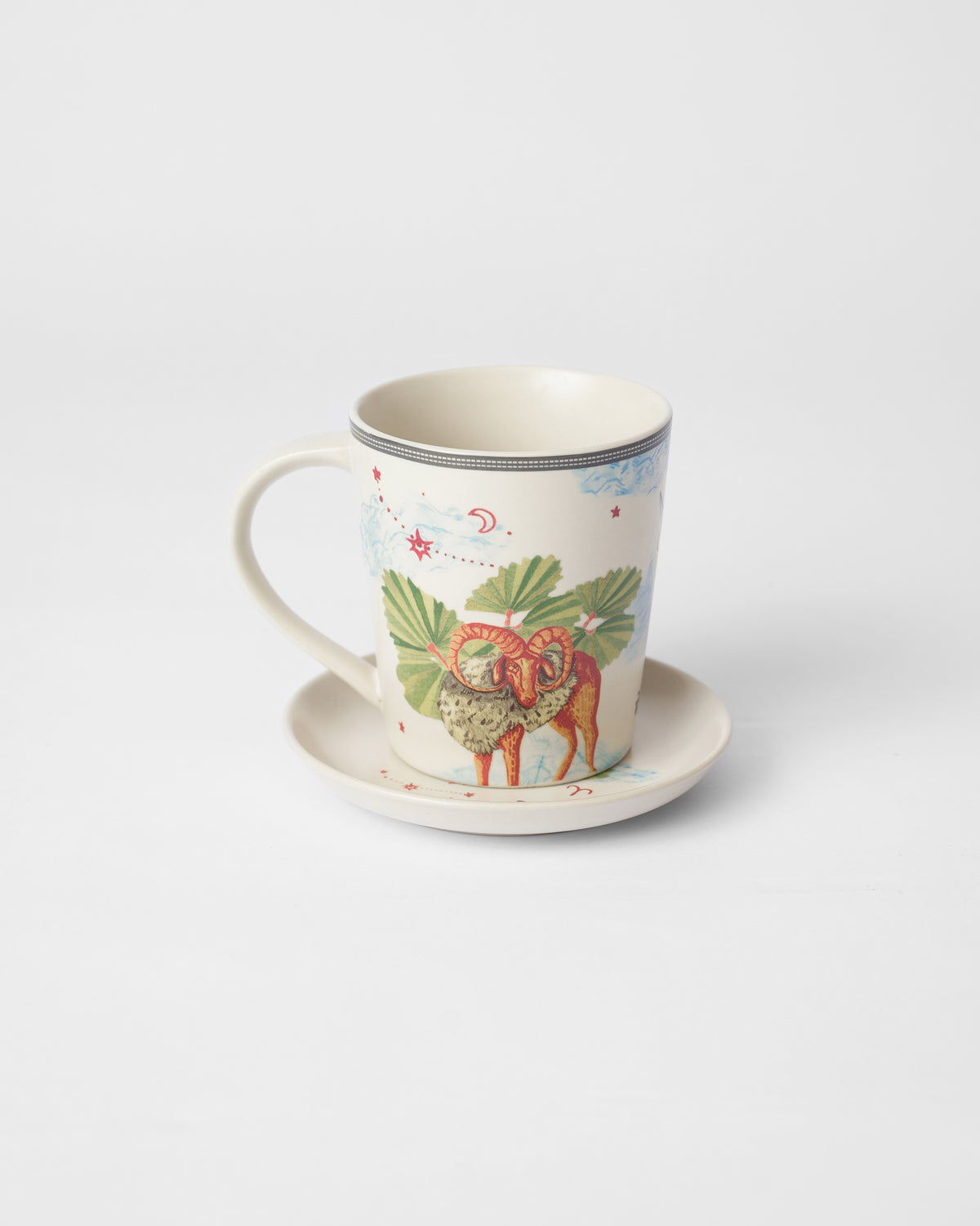 Nico Aries mug on its tea plate showing a ram with curled horns.