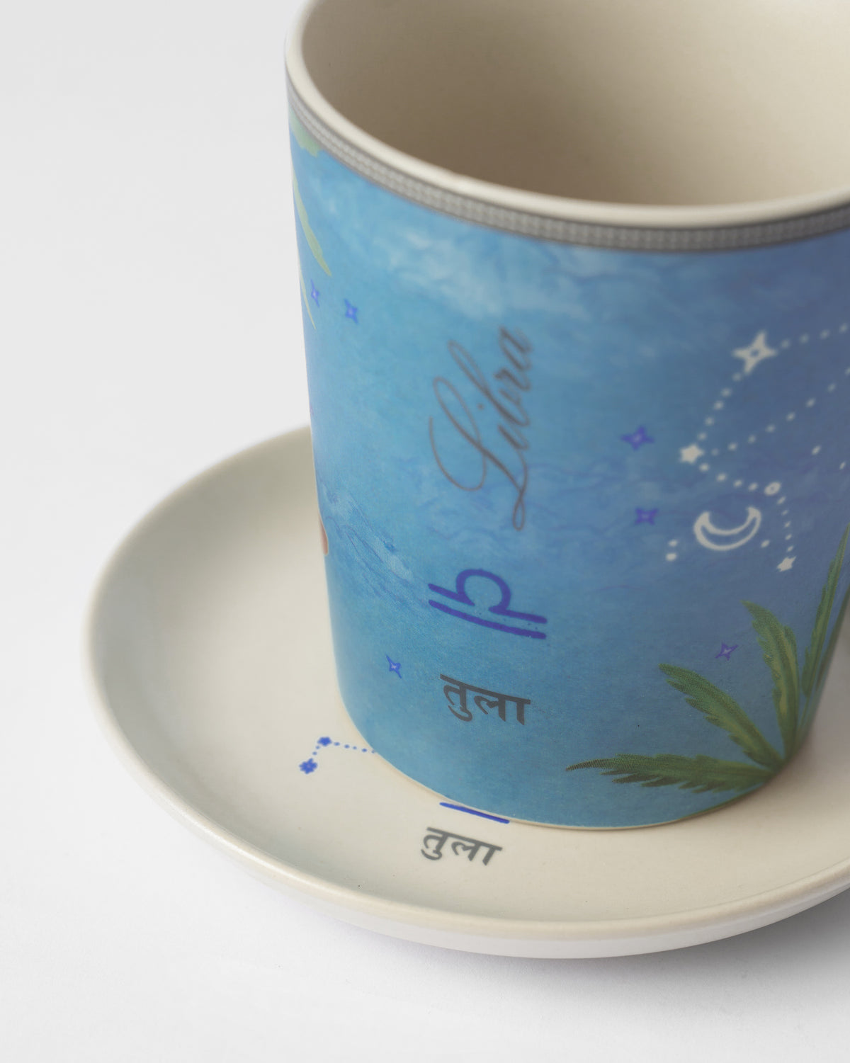 Close-up of a Nico Libra mug showing Libra and Tula lettering with stars.