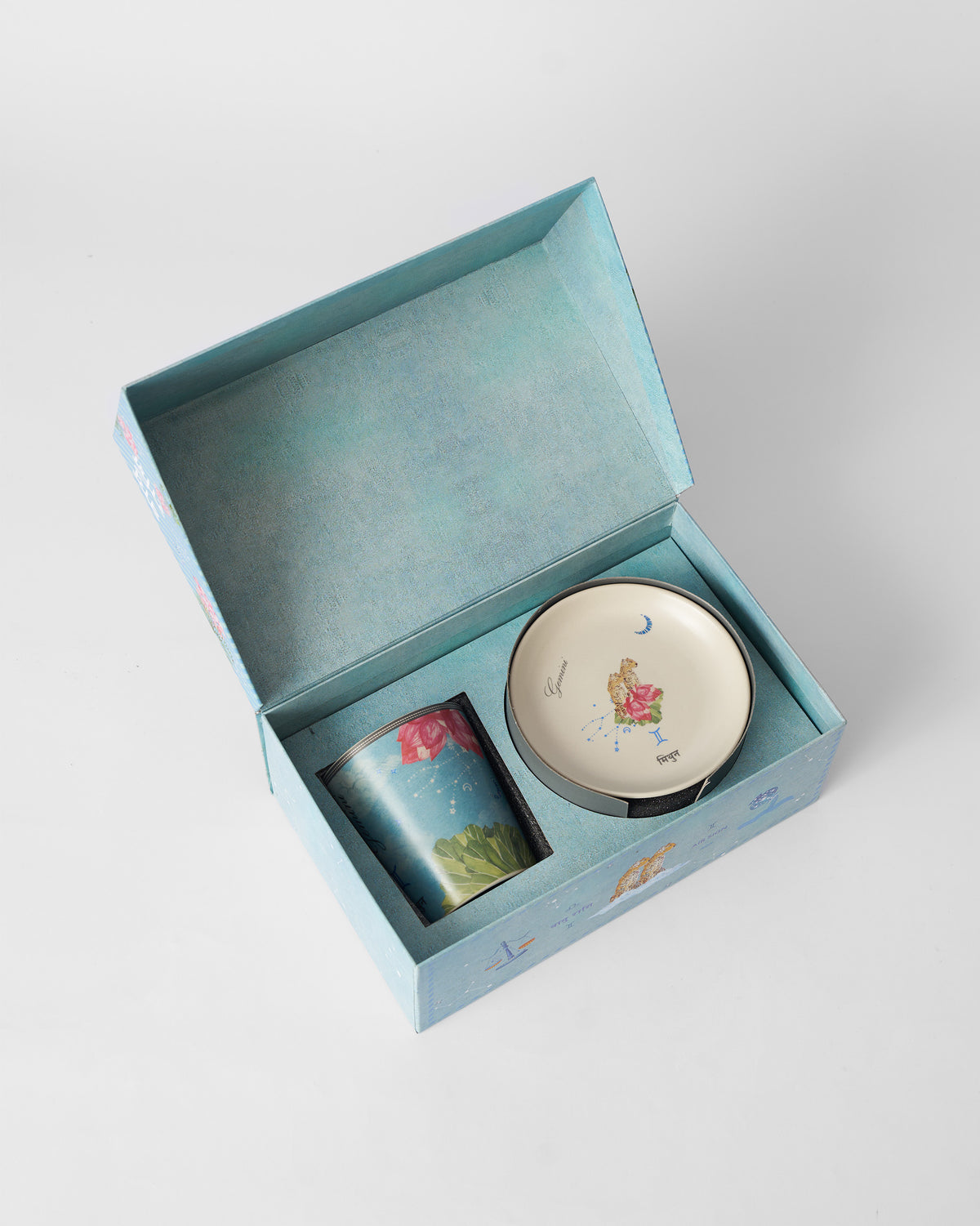 Open Guided by Stars box holding the Gemini mug and tea plate.