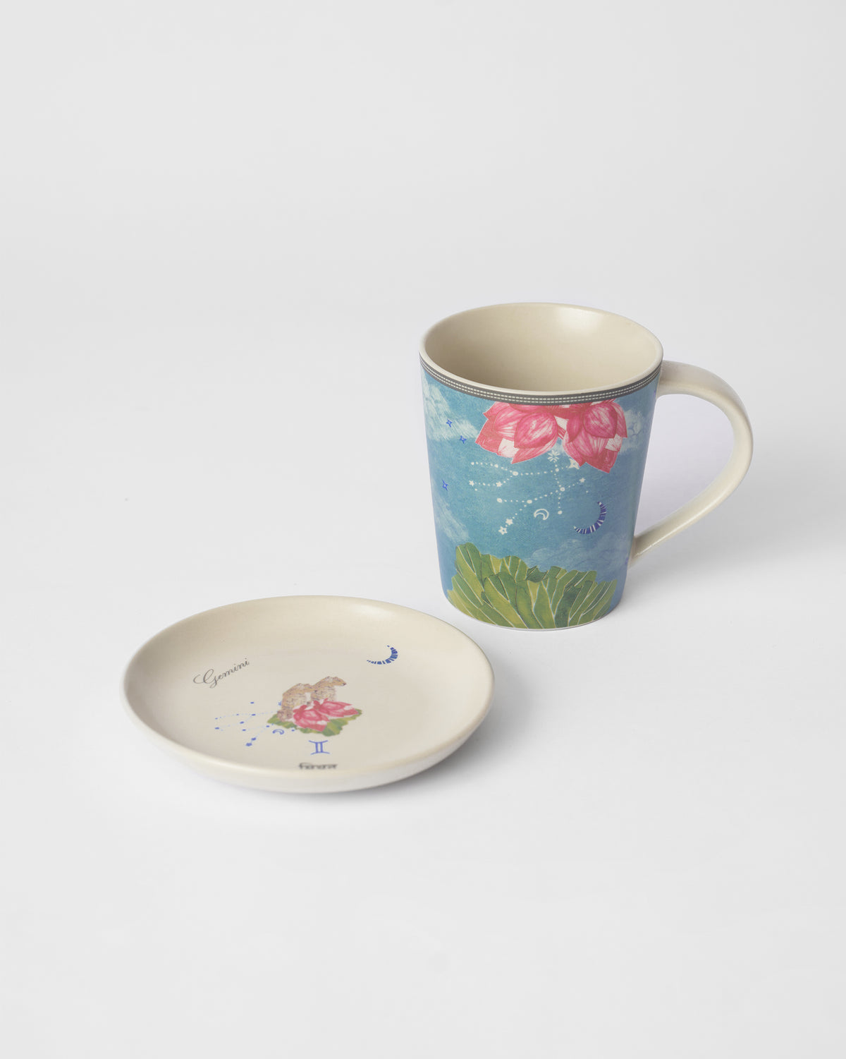 Nico Gemini mug with pink lotus beside its matching tea plate.