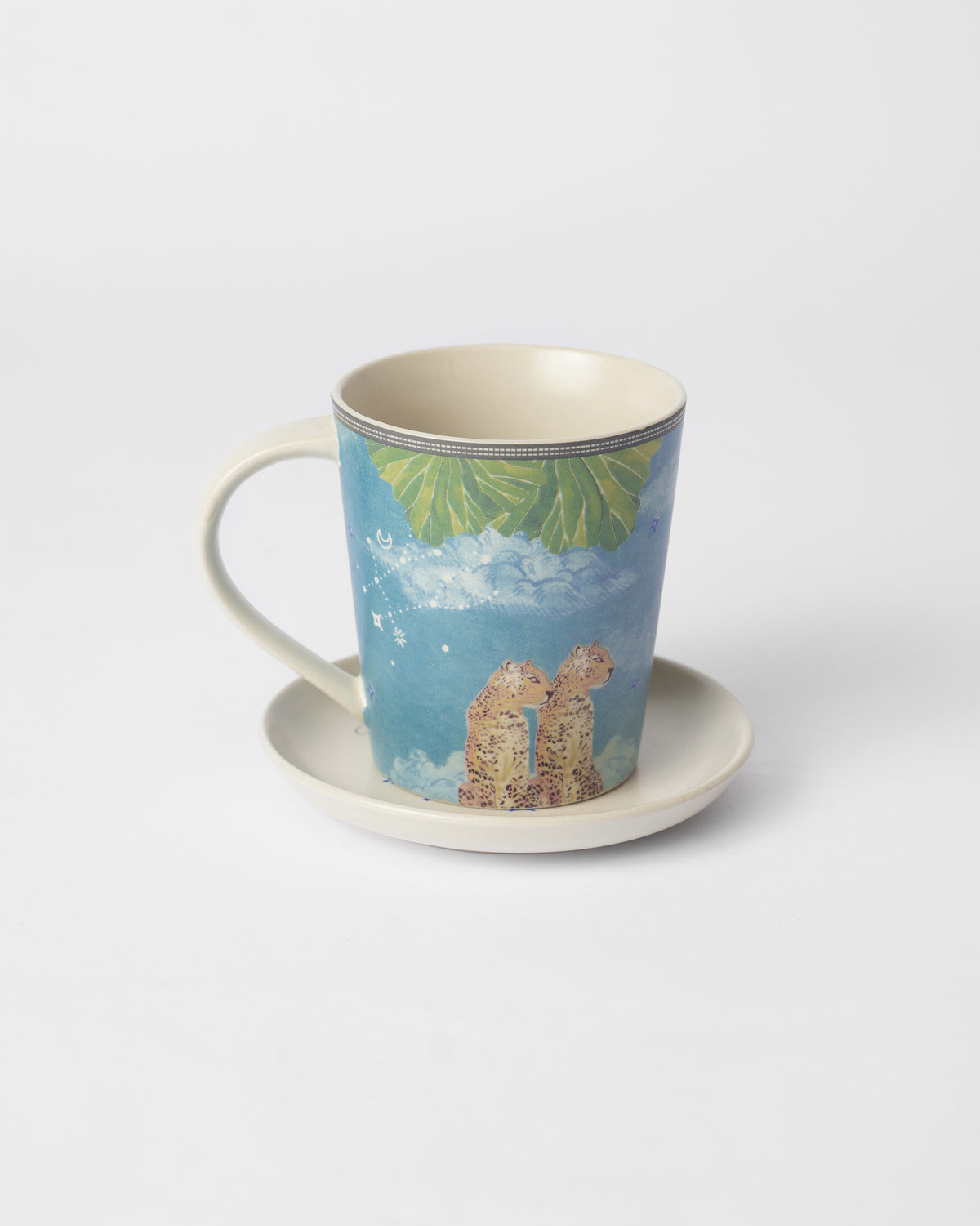 Nico Gemini mug with twin leopards on a cream tea plate.