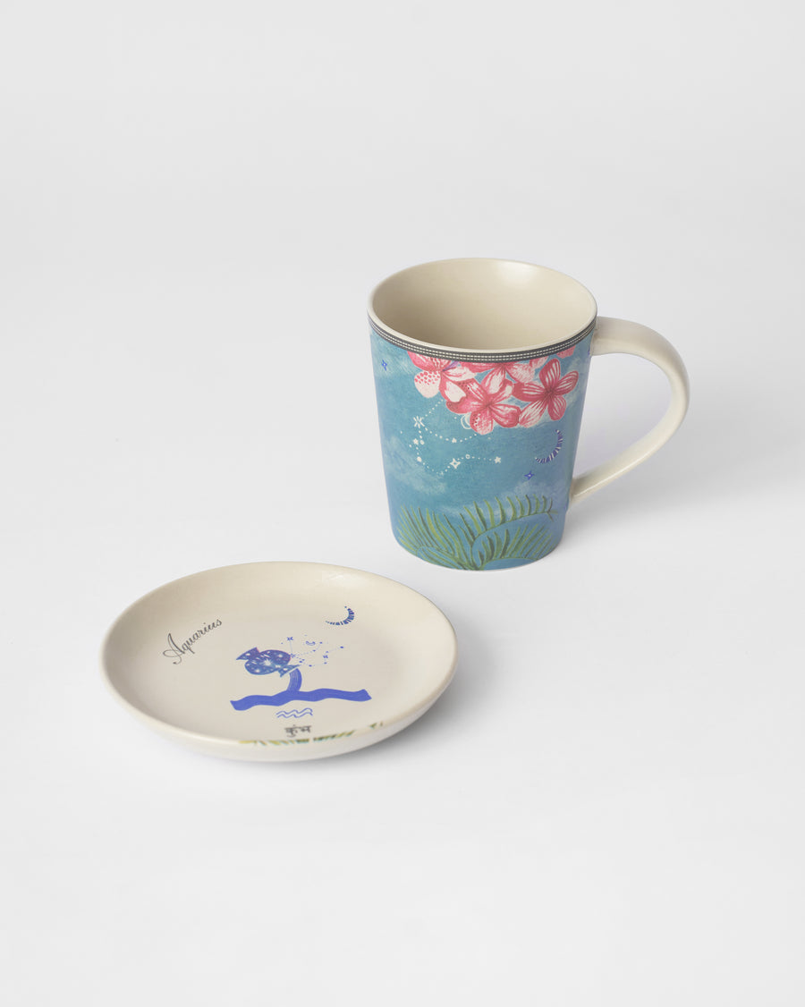 The blue Aquarius mug beside its tea plate