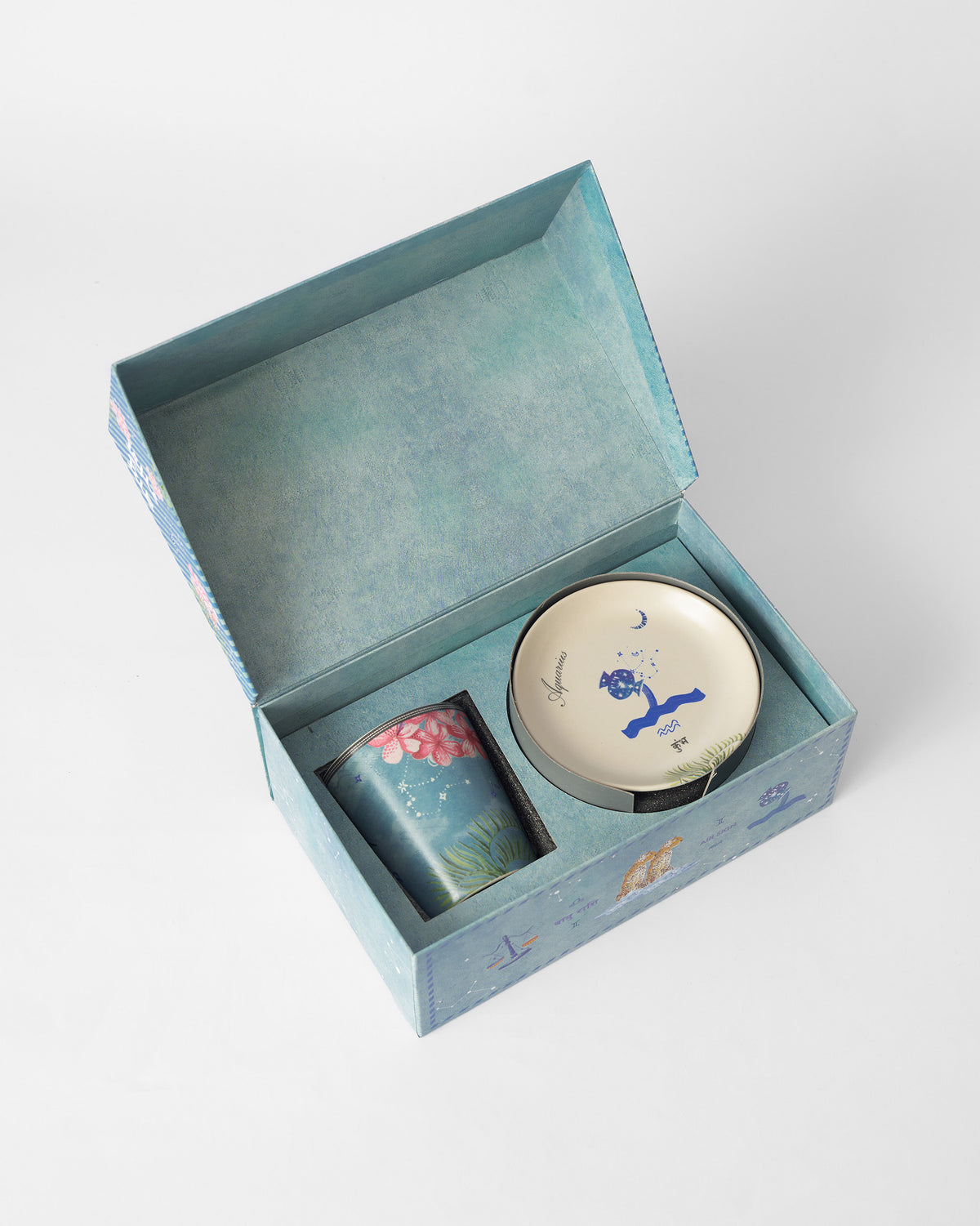 Open Nico Aquarius gift box showing the mug and tea plate.