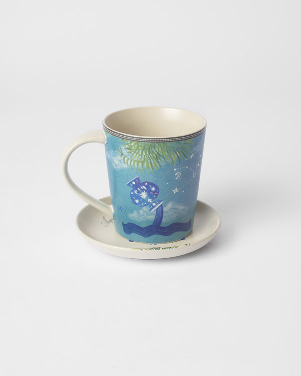 The mug on its plate with the pouring urn