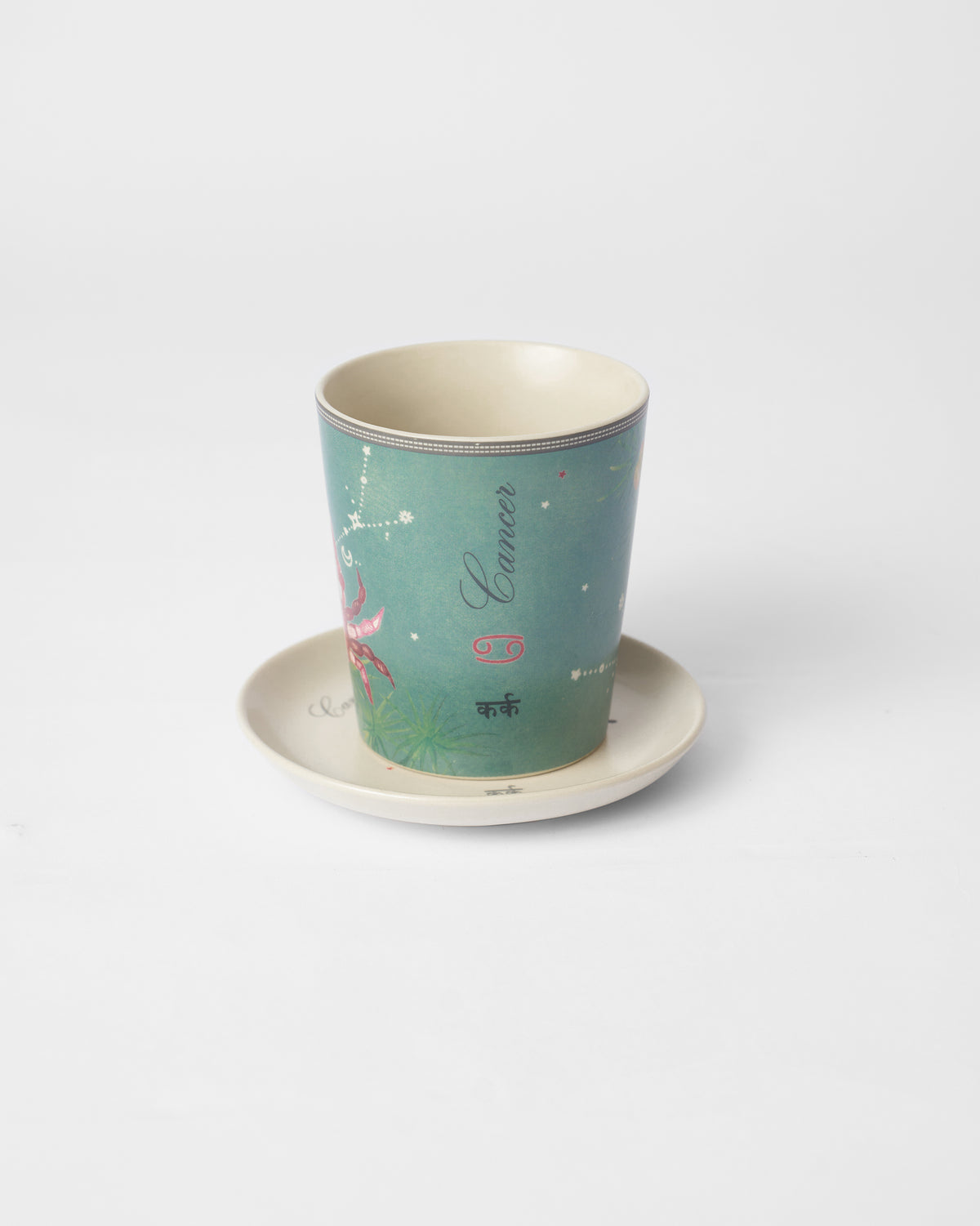 Nico Cancer mug on its plate with crab and Cancer lettering.