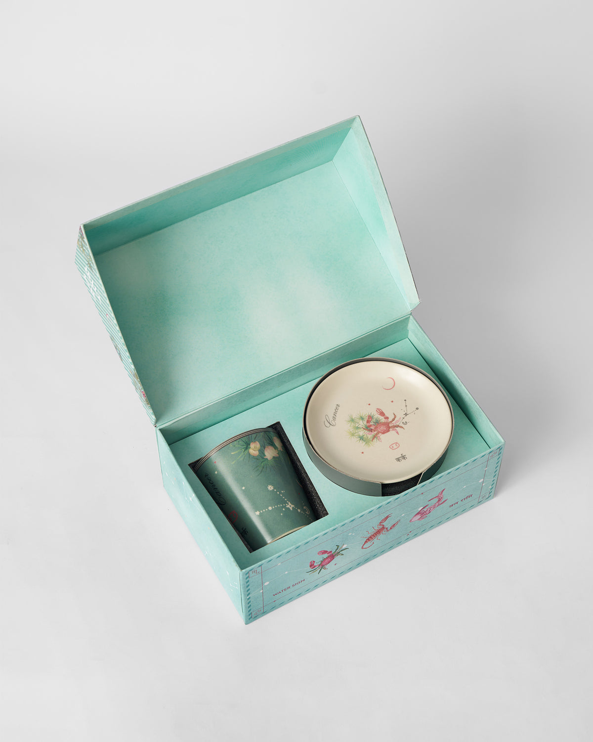 Open Nico Cancer gift box showing the mug and tea plate.