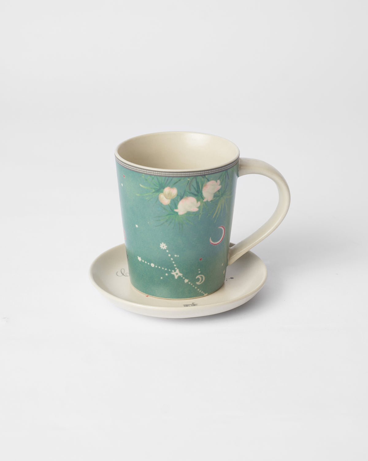 Nico Cancer mug on its plate with constellation and floral print.