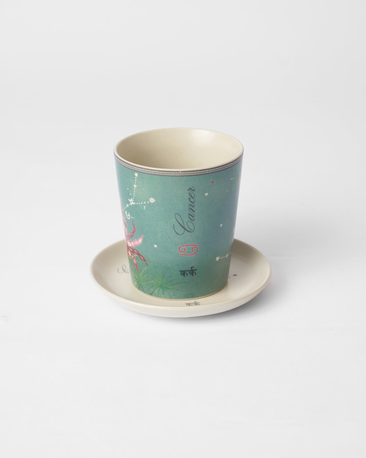 Nico Cancer mug on its plate with Cancer and कर्क lettering.