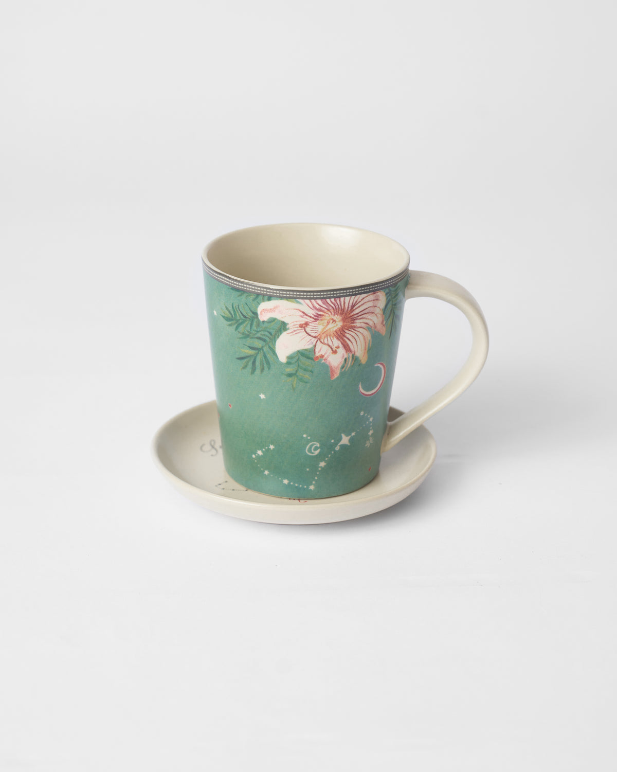 Nico Scorpio mug with a pink lily and constellation dots on its plate.