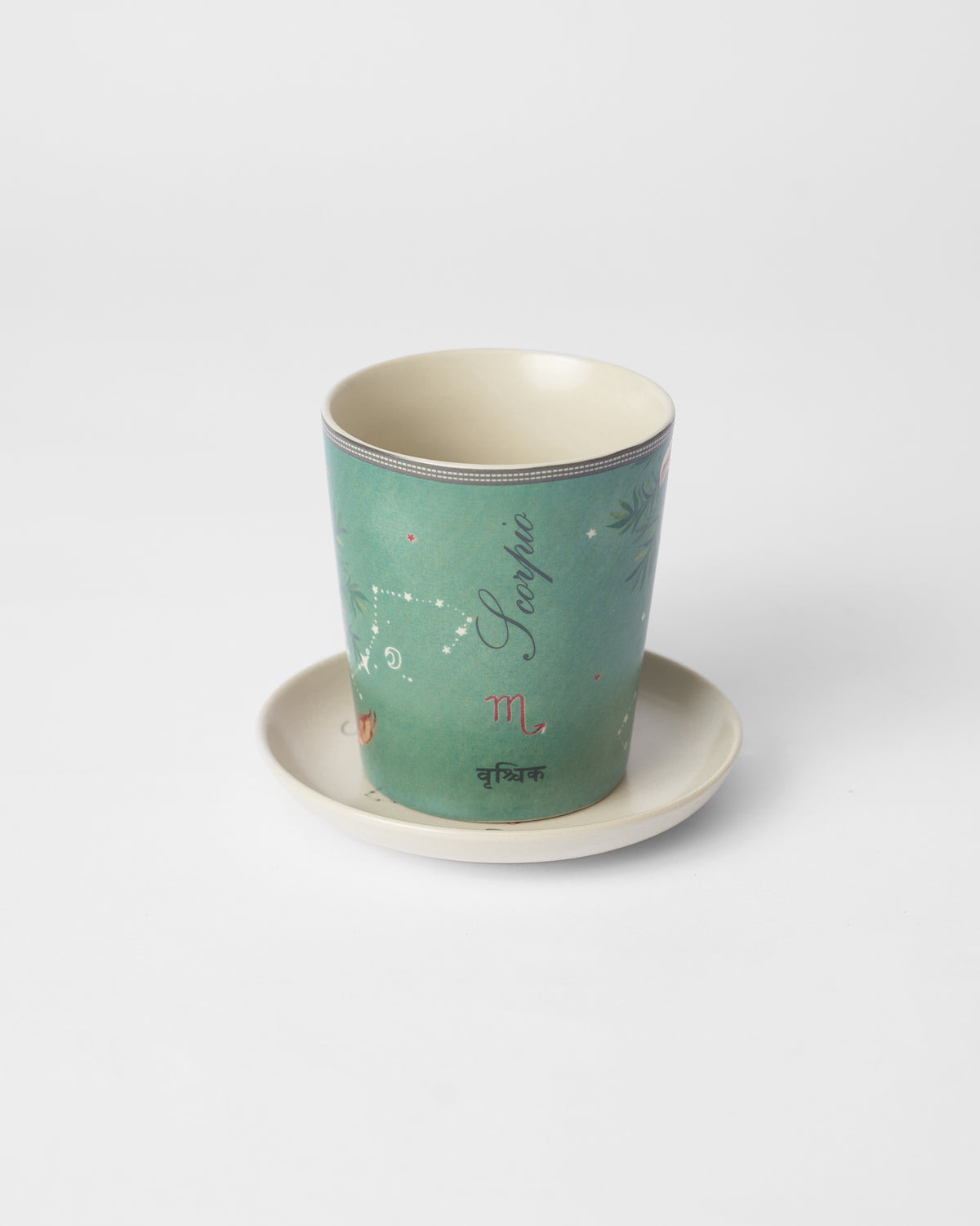 Nico Scorpio mug on its tea plate showing Scorpio and वृश्चिक lettering.