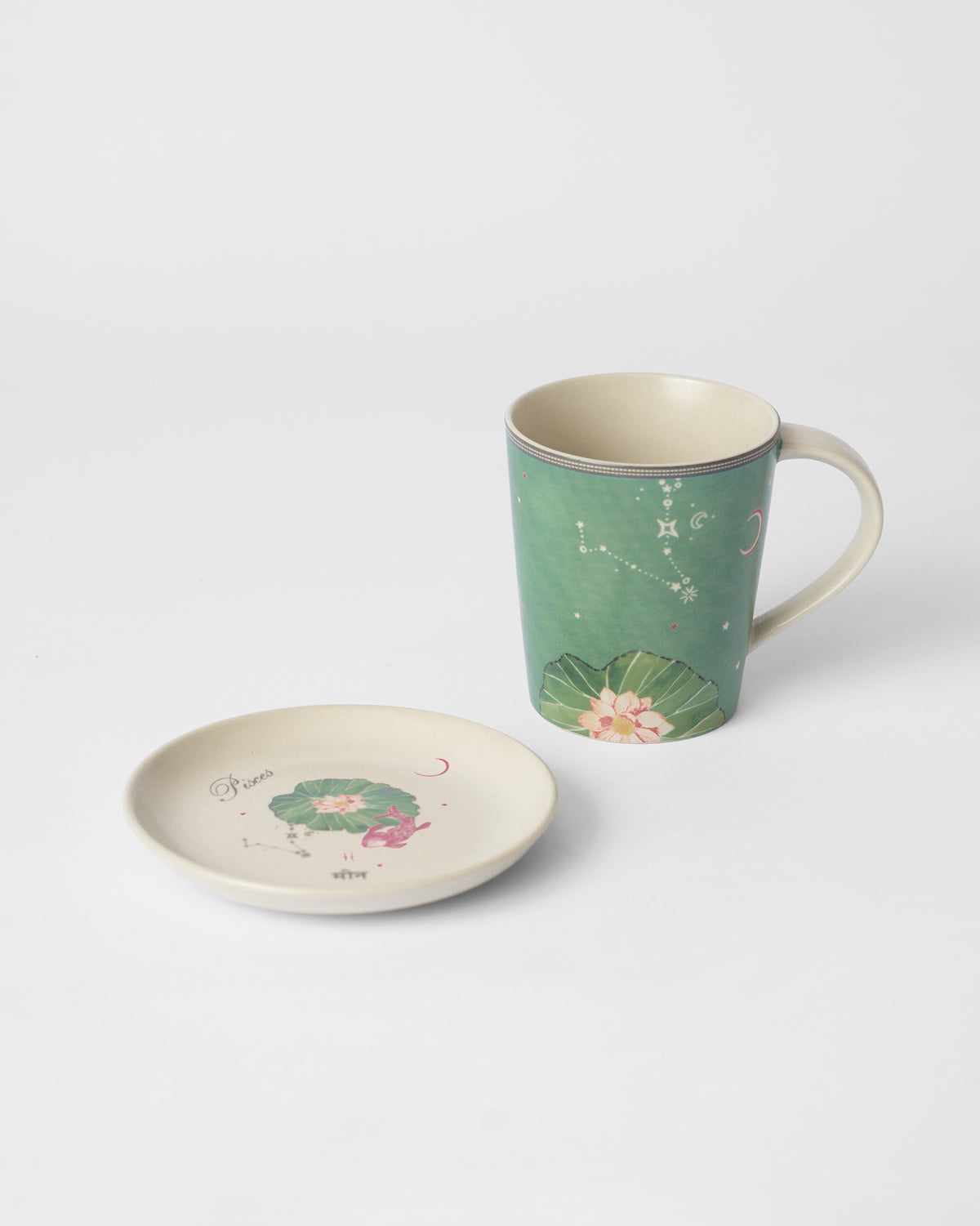 Nico Pisces Gift Set mug and saucer in green with a lotus and pink fish design.