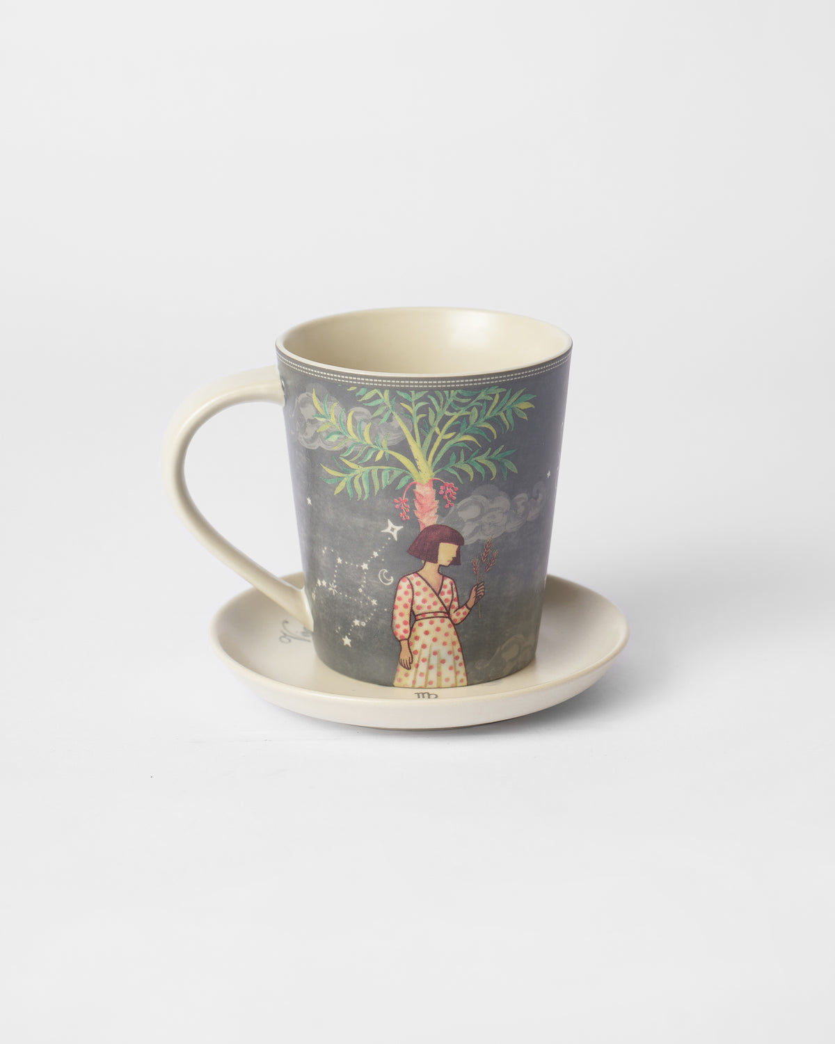 Nico Capricorn Gift Set mug on saucer with palm and figure illustration.