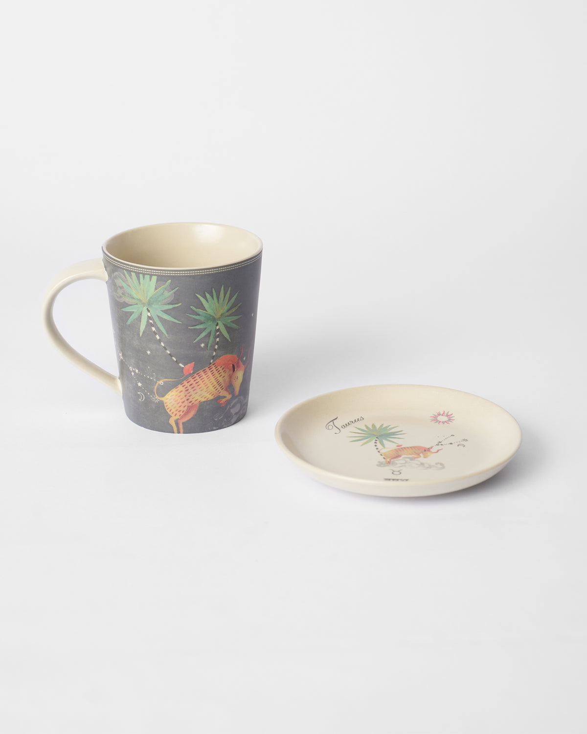 Nico Taurus mug with a bull print beside a matching tea plate.