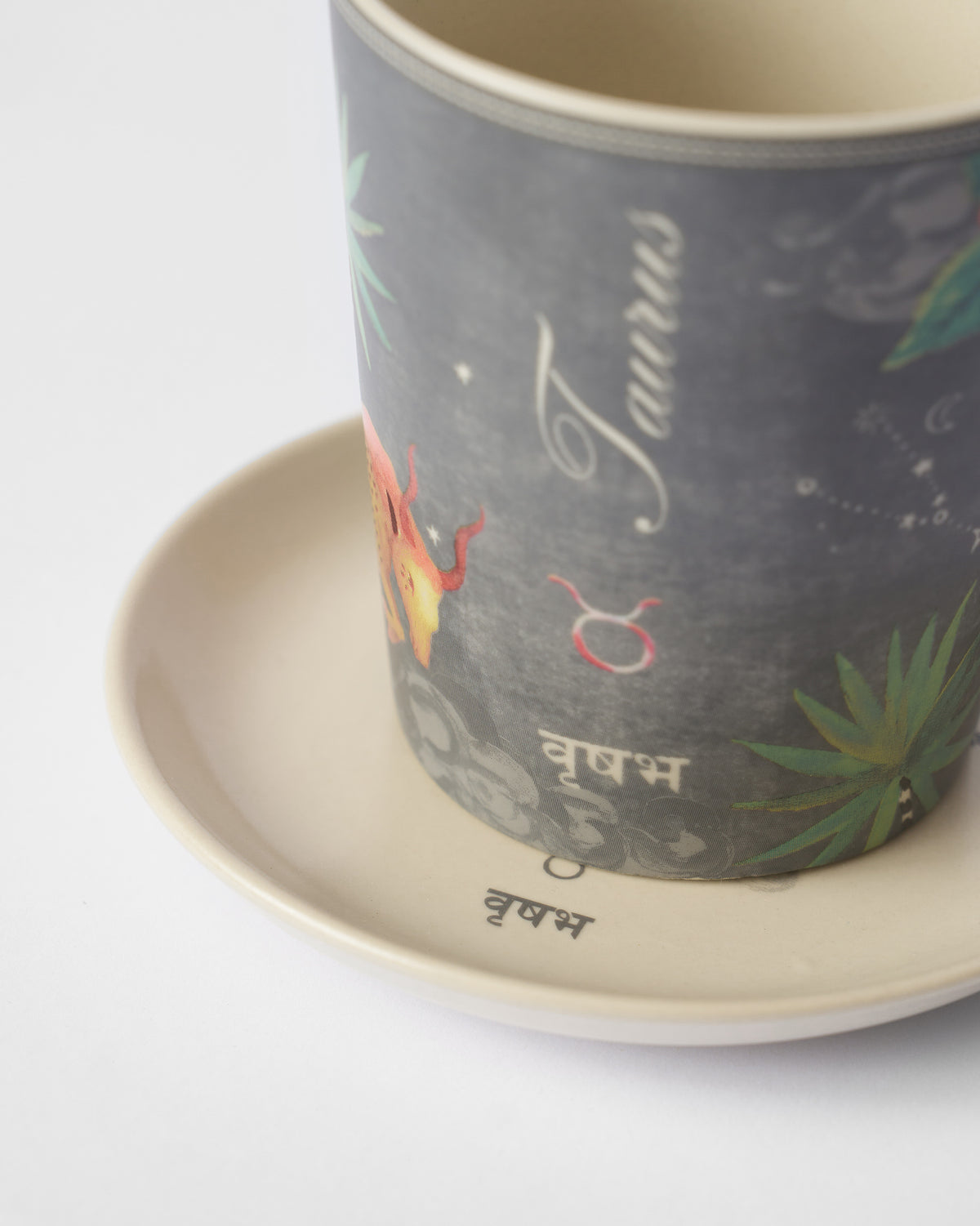 Close-up of the Nico Taurus mug with Taurus and वृषभ lettering.