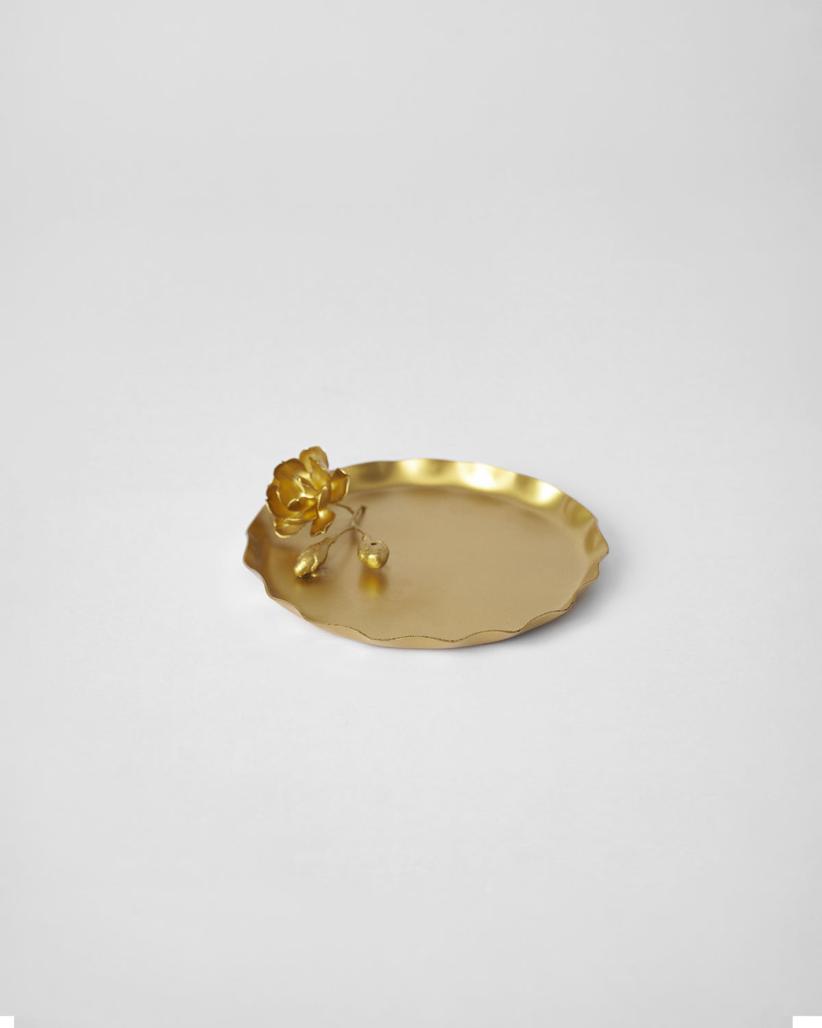 Grove Incense Holder at an angle, with a gold flower resting at one edge.