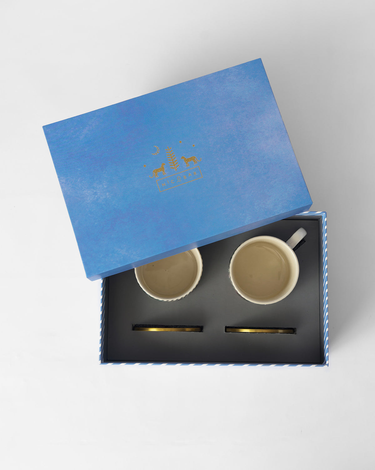 Ceylon Lush mugs in an open blue gift box.