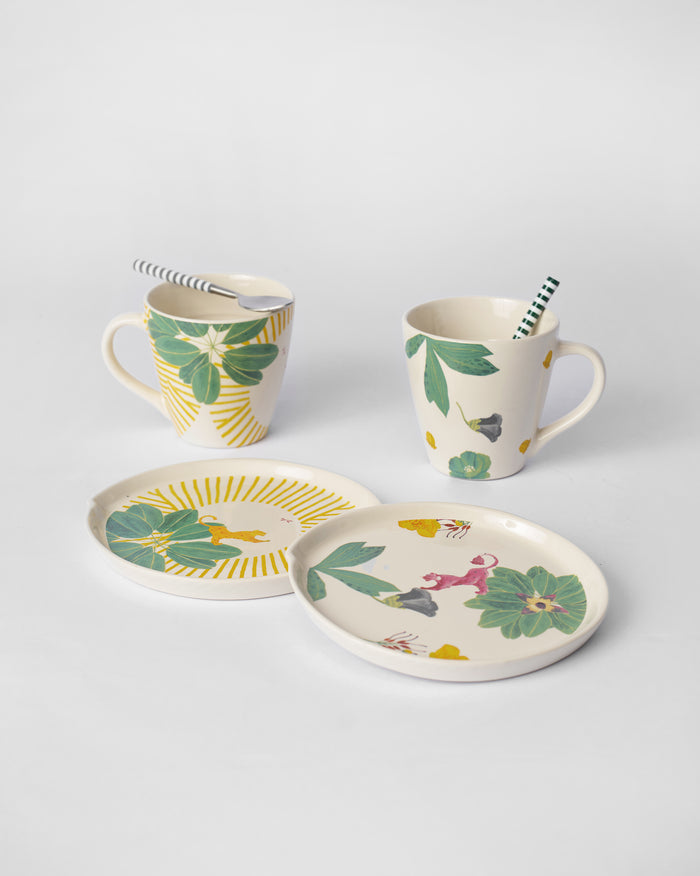 Sunburst and floral dessert plates with their mugs