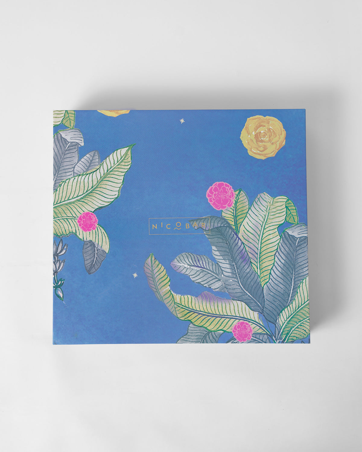 Closed blue botanical Nicobar gift box for the Harappa set.
