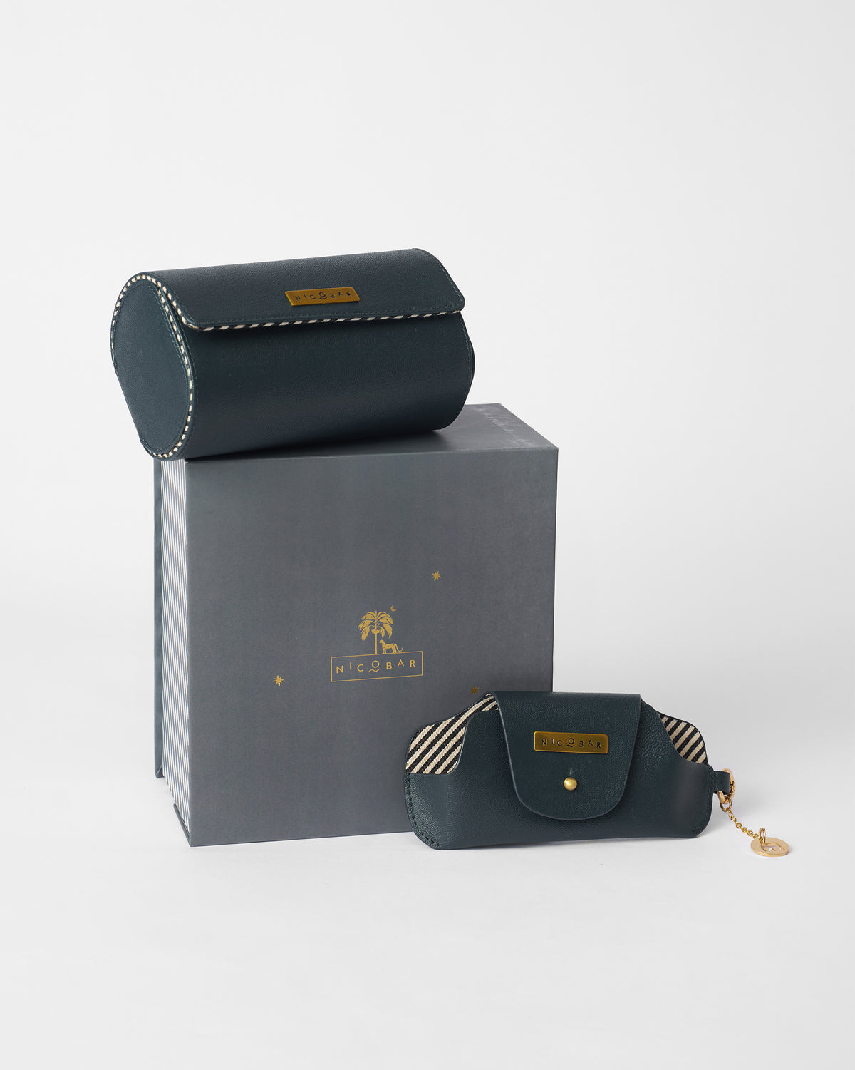 Tusker Gift Set leather roll case and pouch displayed on and beside a grey gift box.