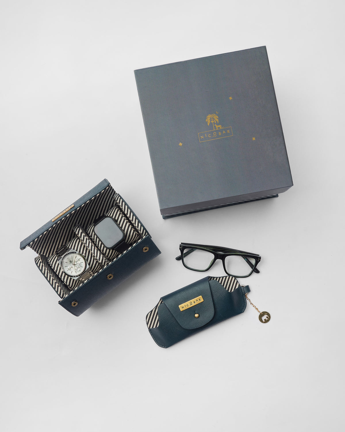 Tusker Gift Set leather pouch placed beside the grey gift box.