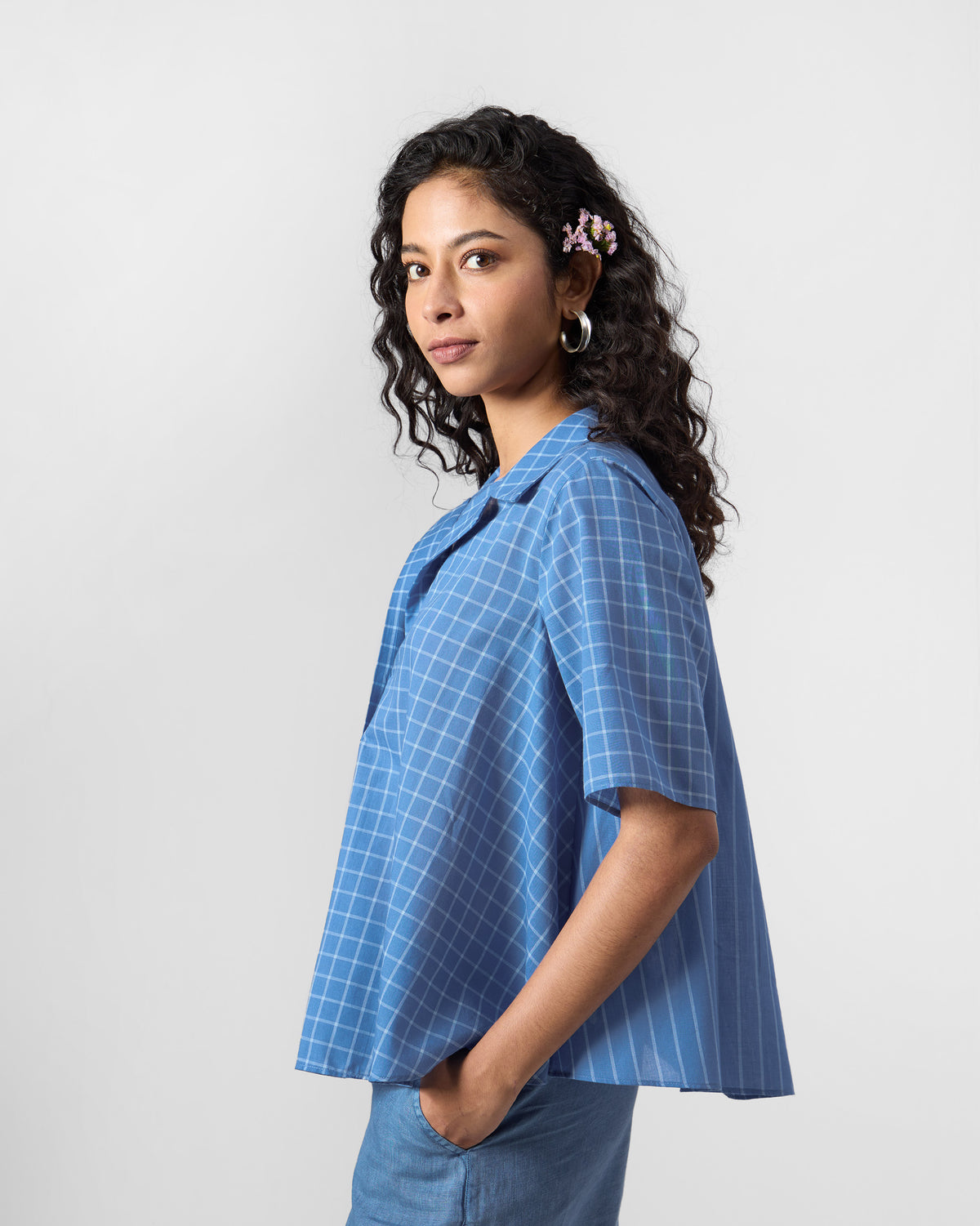 Side view of a riverside blue Rann shirt with mixed checks.