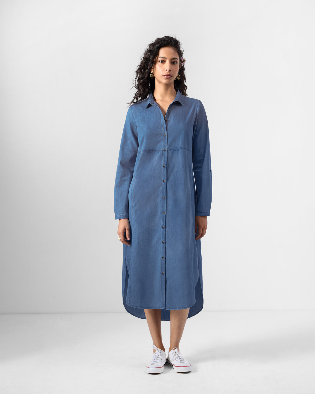 Person wearing a blue Pristine midi shirt dress.