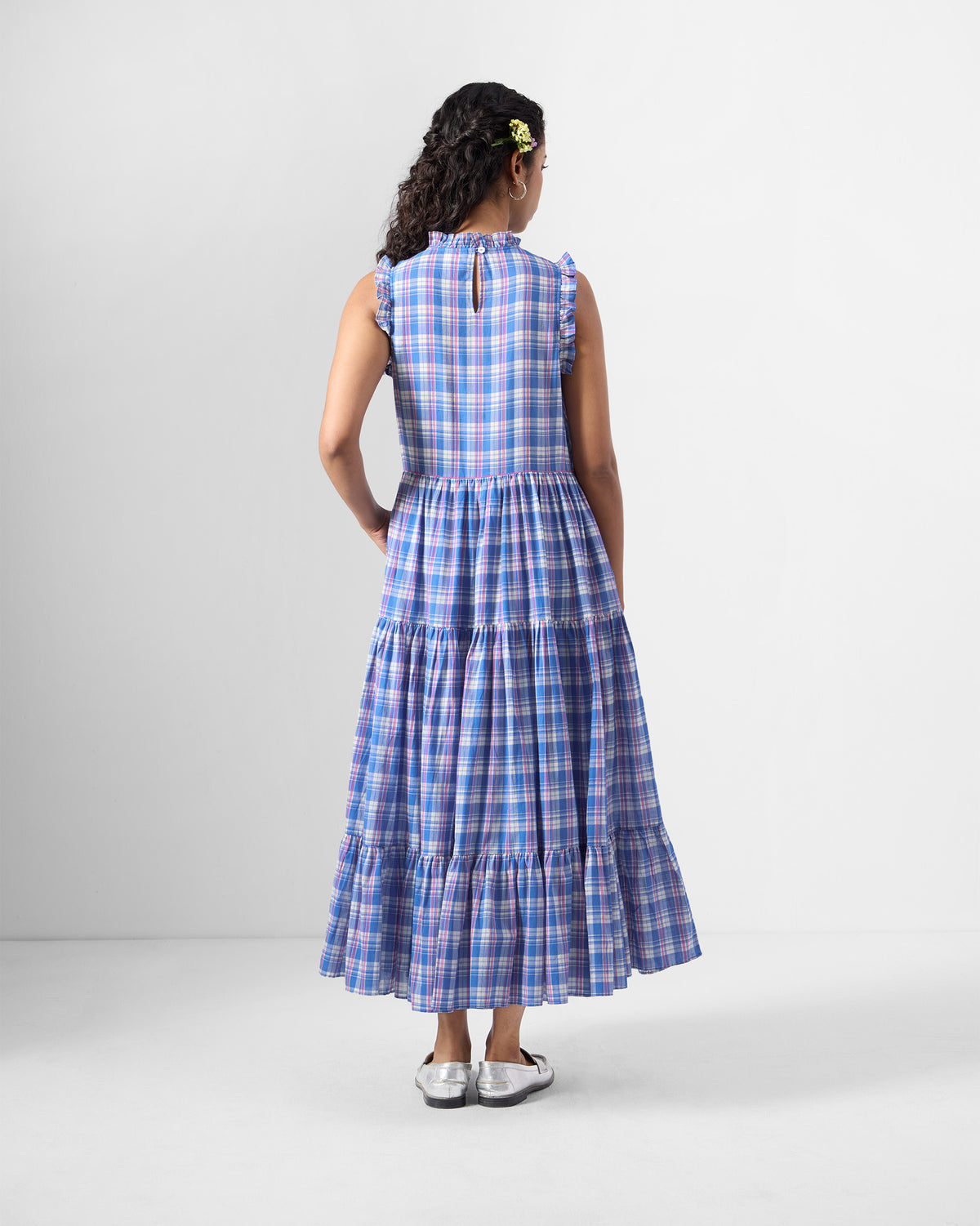 Back of a blue checked Reah dress with a ruffled keyhole collar.