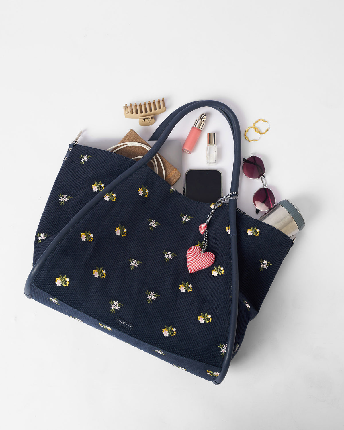 Navy Ditsy bag packed open to show everyday carry capacity.