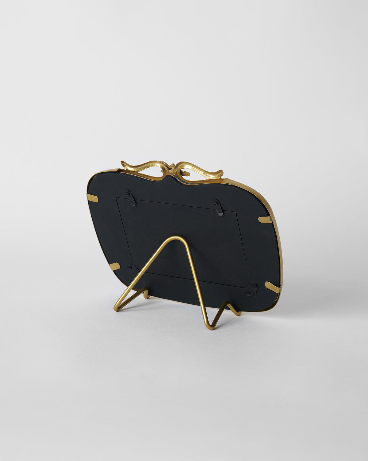 Back of the gold Leap photo frame showing its wire easel stand.