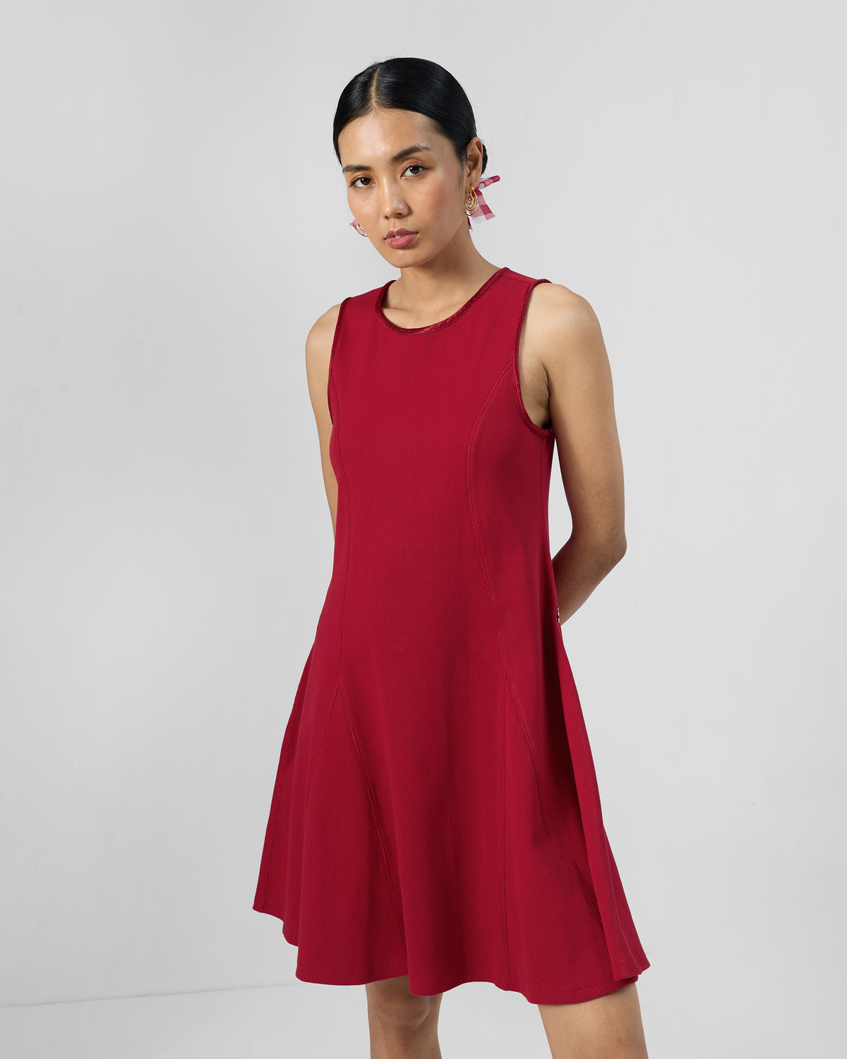 Person wearing a red Norva skater dress.