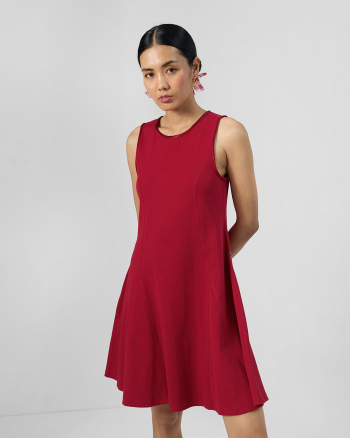 Person wearing a red Norva skater dress.